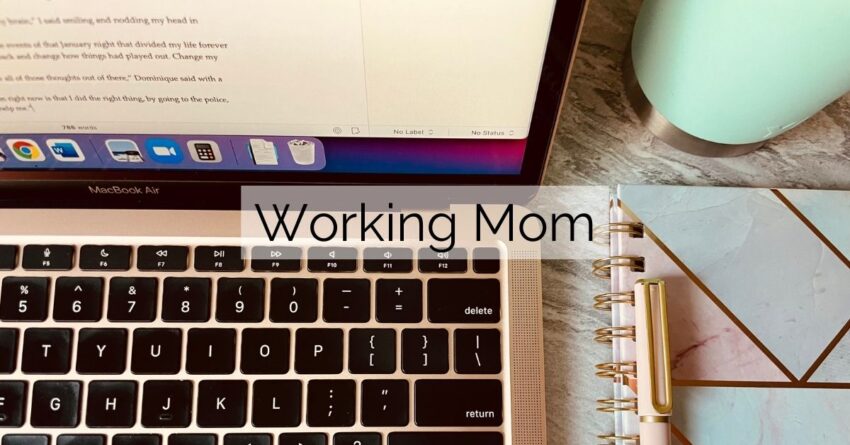 working mom's desk with notebook, cup and laptop